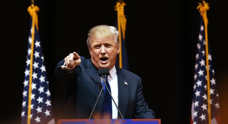 US Republican presidential hopeful Donald Trump speaks to the crowd during a rally February 8, 2016 in Manchester, New Hampshire