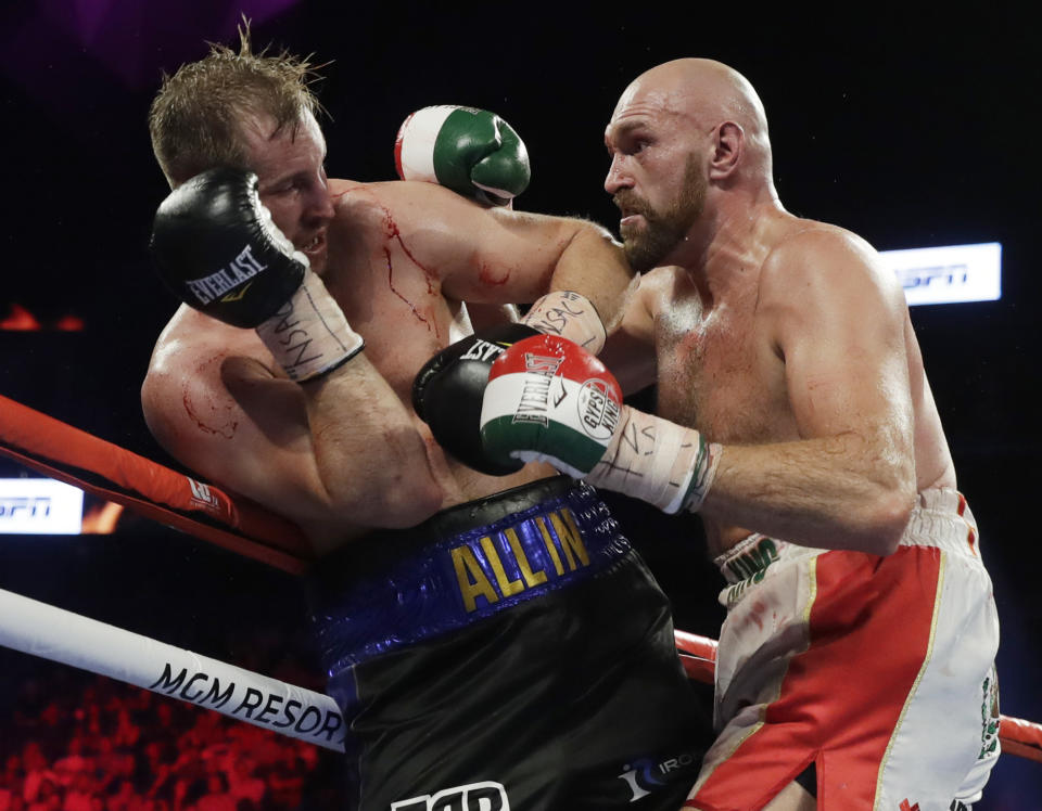 Tyson Fury, right, of England, punches Otto Wallin, of Sweden, during their heavyweight boxing match Saturday, Sept. 14, 2019, in Las Vegas. (AP Photo/Isaac Brekken)