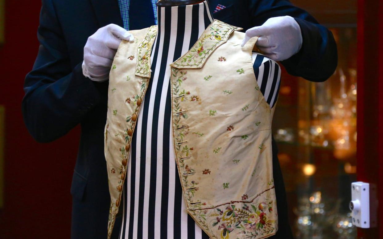 A 250-year-old embroidered silk waistcoat that belonged to Captain James Cook on a mannequin during a display in Sydney, Australia - REUTERS