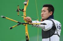 <p>Bonchan Ku of Korea competes in the Men’s Individual round of 8 Elimination Round on Day 7 of the Rio 2016 Olympic Games at the Sambodromo on August 12, 2016 in Rio de Janeiro, Brazil. (Getty) </p>