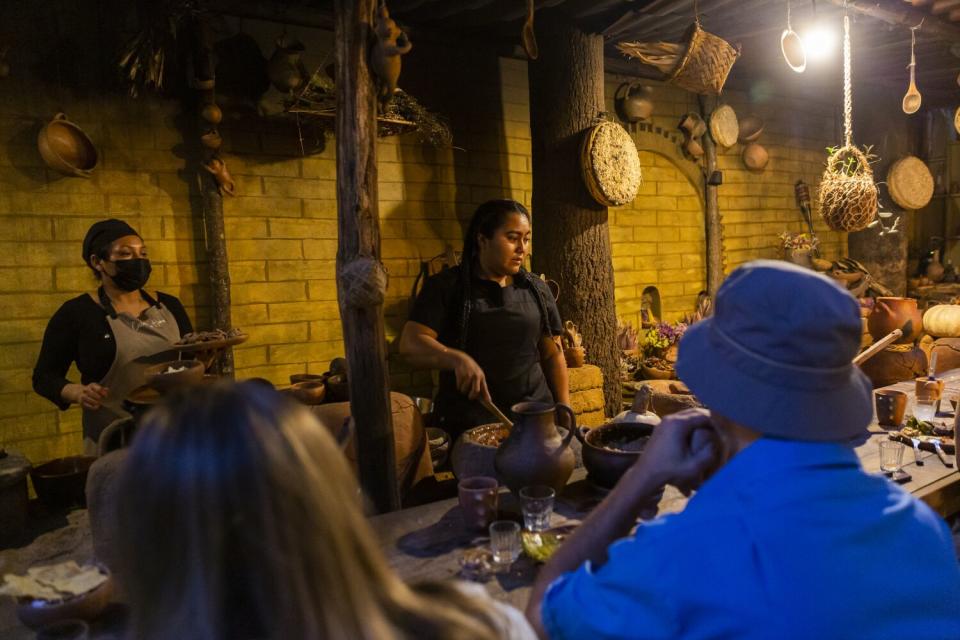 Chef Thalia Barrios preparing Machucado de Chapulines, is a sauce containing grasshoppers, tortillas and cheese