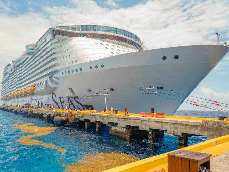 wonder of the seas ship docked on a cloudy day