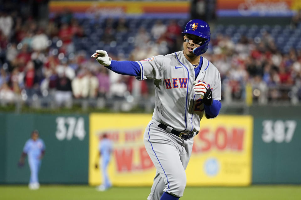 New York Mets' Mark Vientos reacts after hitting a home run against Philadelphia Phillies pitcher Ranger Suarez during the sixth inning of a baseball game, Thursday, Sept. 21, 2023, in Philadelphia. (AP Photo/Matt Slocum)