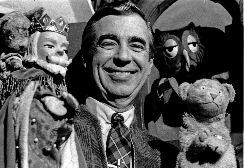 Fred Rogers poses with some of the residents of the Neighborhood of Make-Believe: King Friday (left), Daniel Striped Tiger and X the Owl in 1984.