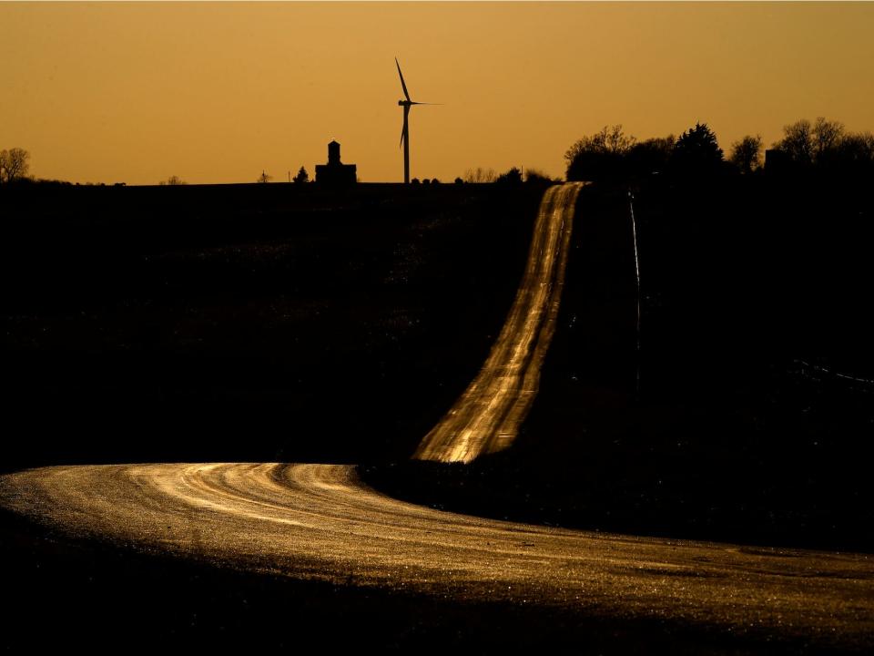 An empty country road glows as the sun sets, Sunday, March 29, 2020, near King City, Mo., as people stay at home in order to help stem the spread of the new coronavirus. 