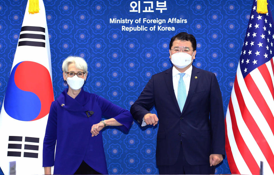 In this photo provided by South Korea Foreign Ministry, U.S. Deputy Secretary of State Wendy Sherman, left, bumps elbows with South Korean First Vice Foreign Minister Choi Jong Kun prior to their meeting at the Foreign Ministry in Seoul, South Korea, Friday, July 23, 2021. Top U.S. and South Korean officials agreed Thursday to try to convince North Korea to return to talks on its nuclear program, which Pyongyang has insisted it won't do in protest of what it calls U.S. hostility. (South Korea Foreign Ministry via AP)