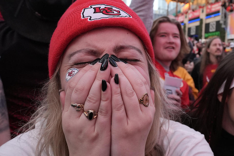 Kansas City Chiefs fan Shayla Mille reacts at a watch party in downtown Kansas City, Mo. after the Chiefs beat the Baltimore Ravens to win the AFC Championship NFL football game Sunday, Jan. 28, 2024. (AP Photo/Charlie Riedel)