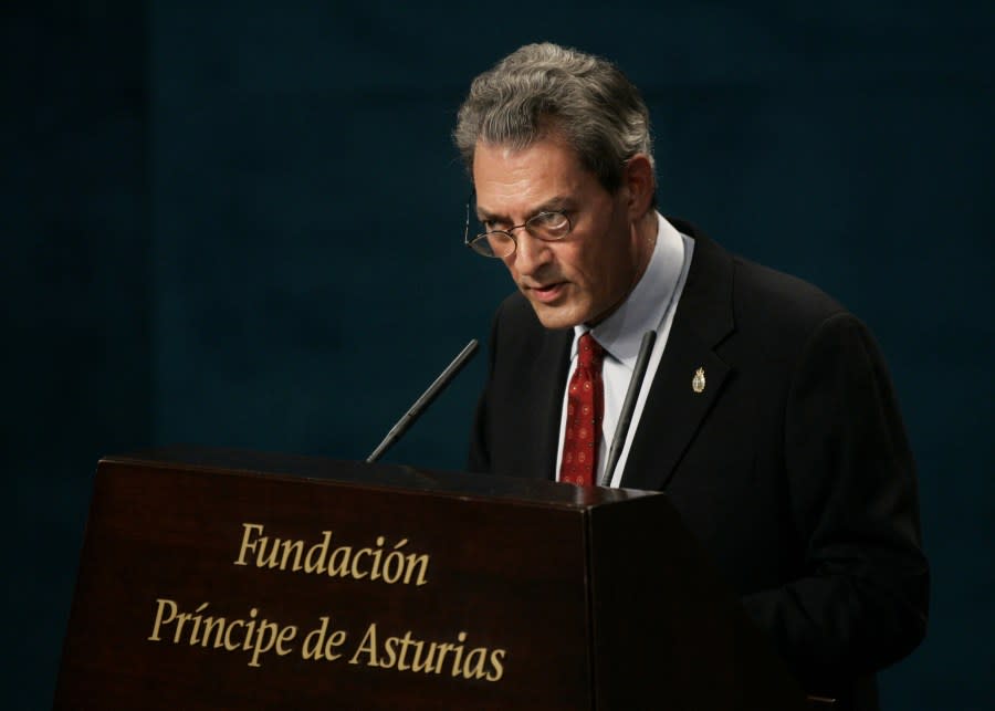 FILE – U.S. author Paul Auster makes a speech before receiving the 2006 Prince of Asturias award for Literature from Prince Felipe of Spain and Asturias at a ceremony in Oviedo, northern Spain, Oct. 20, 2006. Paul Auster, a prolific, prize-winning man of letters and filmmaker known for such inventive narratives and meta-narratives as “The New York Trilogy” and “4 3 2 1,” has died at age 77. (AP Photo/Bernat Armangue, File)