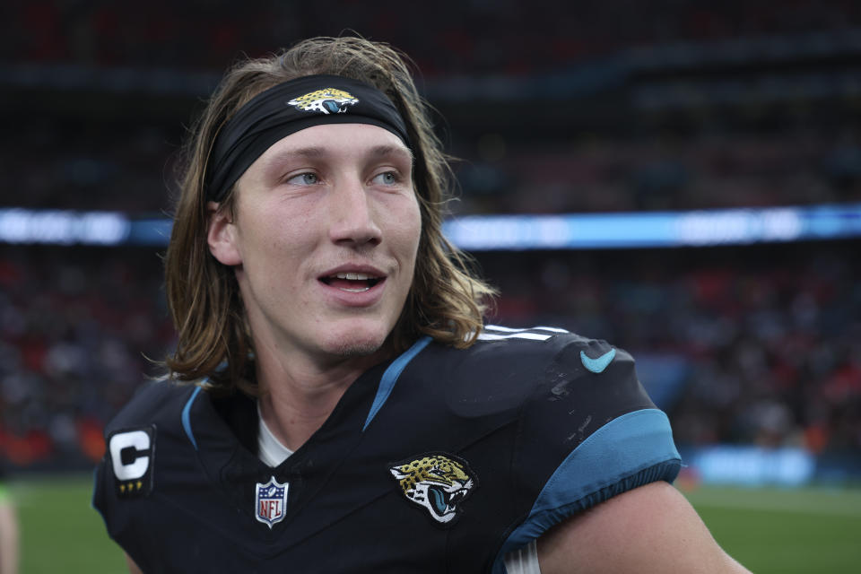 Jacksonville Jaguars quarterback Trevor Lawrence (16) stands on the field at the end of an NFL football game between the Atlanta Falcons and the Jacksonville Jaguars at Wembley stadium in London, Sunday, Oct. 1, 2023. Jacksonville Jaguars won the game 23-7. (AP Photo/Ian Walton)