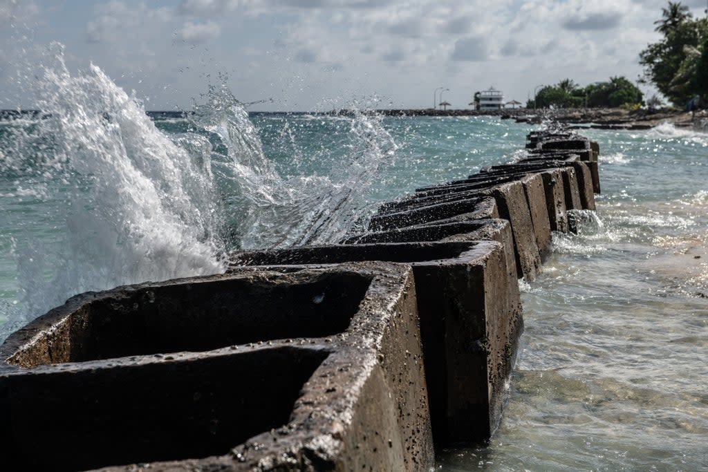 Concrete blocks have been put in place to prevent further coastal erosion in Mahibadhoo in the Maldives (Getty Images)