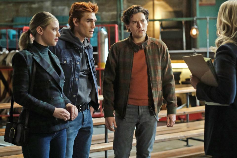 Lili Reinhart as Betty Cooper, KJ Apa as Archie Andrews and Cole Sprouse as Jughead Jones