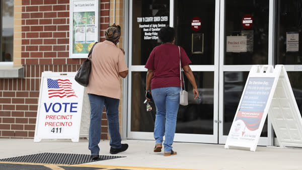 Hillsborough County voters enter their polling place to cast their ballots on primary election day on Aug. 23, 2022, in Tampa, Fla. 