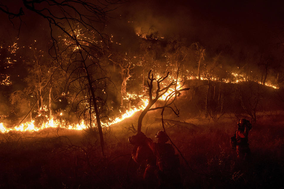 Wildfires rage in sweltering California