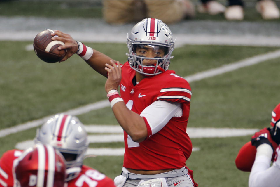 FILE - Ohio State quarterback Justin Fields throws a pass against Indiana during the first half of an NCAA college football game in Columbus, Ohio, in this Saturday, Nov. 21, 2020, file photo. Fields threw a Sugar Bowl-record six touchdown passes and accumulated 385 yards passing in the third-ranked Buckeyes’ 49-28 College Football Playoff semifinal victory over No. 2 Clemson. (AP Photo/Jay LaPrete, File)