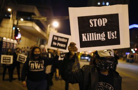 Protesters march through the streets as they demonstrate against what they say is police brutality after the Ferguson shooting of Michael Brown, an unarmed black teenager, by a white police officer, in St. Louis, Missouri, March 14, 2015. REUTERS/Jim Young