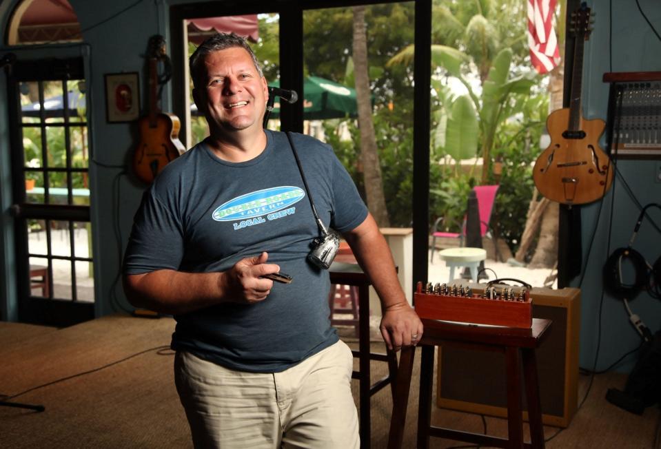 Flashback to 2014: Vince Flora stands on the stage of his then-new Double Roads Tavern in Jupiter. Flora is a longtime blues and rock musician.