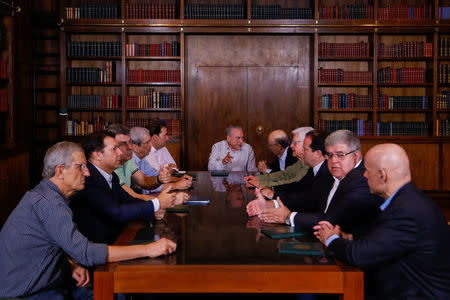 Brazil's president Michel Temer (C) is seen during a meeting of the Pension Reform Commission at the Alvorada Palace in Brasilia, Brazil April 16, 2017. Picture taken April 16, 2017. Marcos Correa/Courtesy of Brazil Presidency/Handout via REUTERS