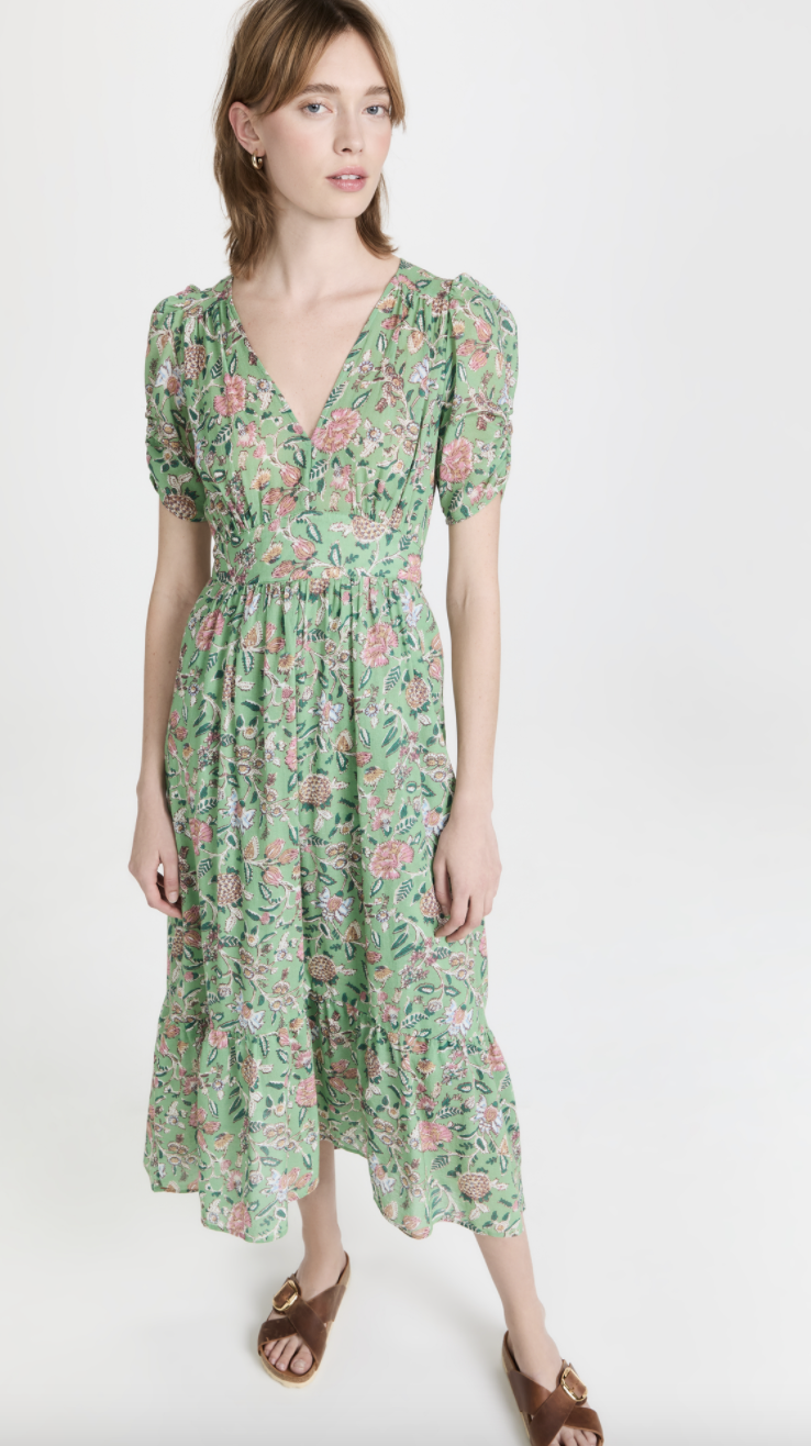 model in brown sandals and light green and pink floral XIRENA Camelia Dress (Photo via Shopbop)