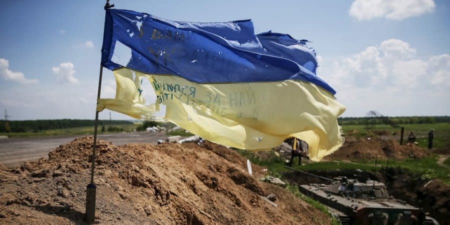 A Ukrainian flag at the war front