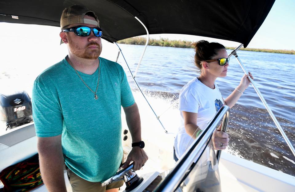 R2C2 volunteers Tony Bahnsen, left, and Kay Balok head by boat to Pine Island near Fort Myers, Fla., on Wednesday, October 5, 2022.