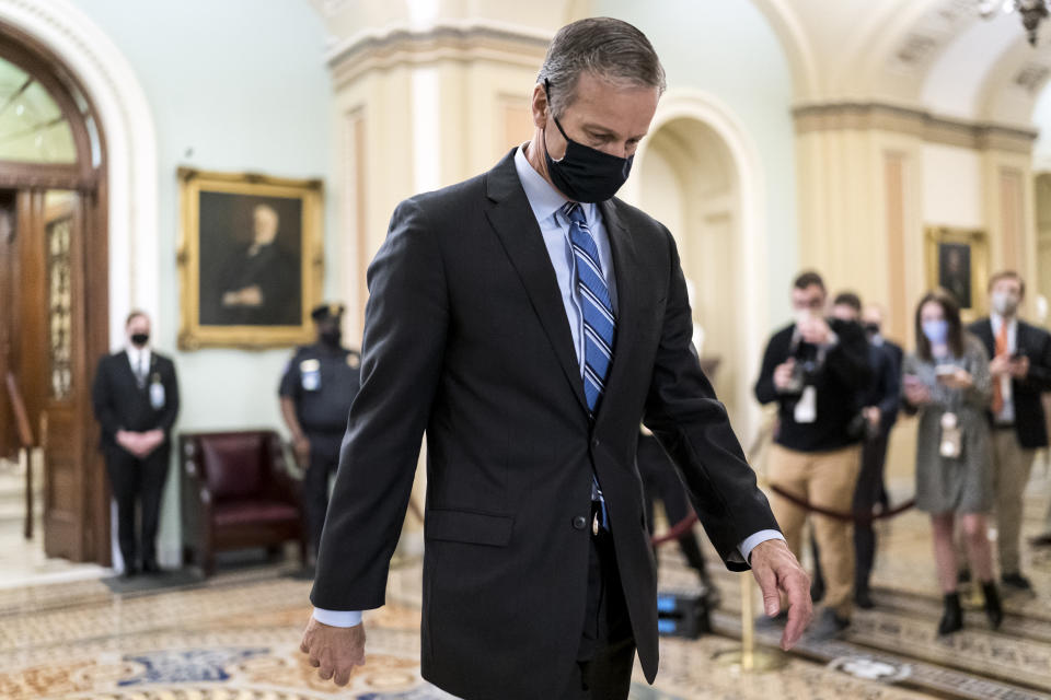 Minority Whip John Thune, R-S.D., leaves the chamber as the Senate voted to consider hearing from witnesses in the impeachment trial of former President Donald Trump, at the Capitol in Washington, Saturday, Feb. 13, 2021. (J. Scott Applewhite/AP)