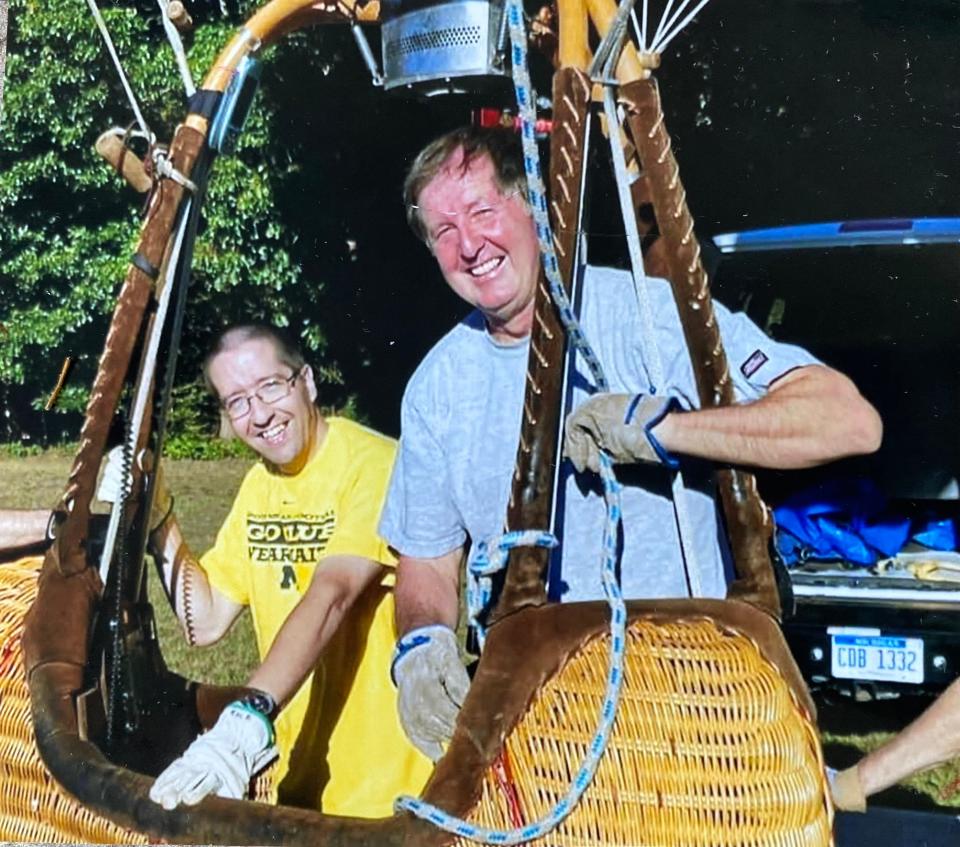 This undated photo shows Russell Rolfe preparing to launch in a balloon with his father, Pat Rolfe. Russell died of cancer on Dec, 24, 2021.