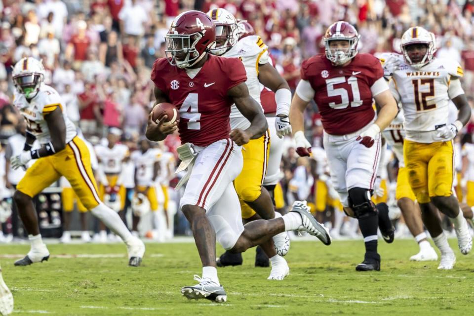 Jalen Milroe runs with the ball against Louisiana-Monroe.