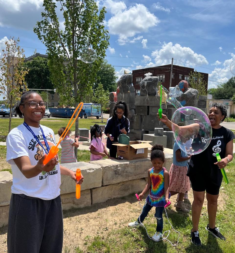 The EN-RICH-MENT Fine Arts Academy's summer camp takes place in a park outside organization's new permanent home in the former Ziegler Tire building in downtown Canton.