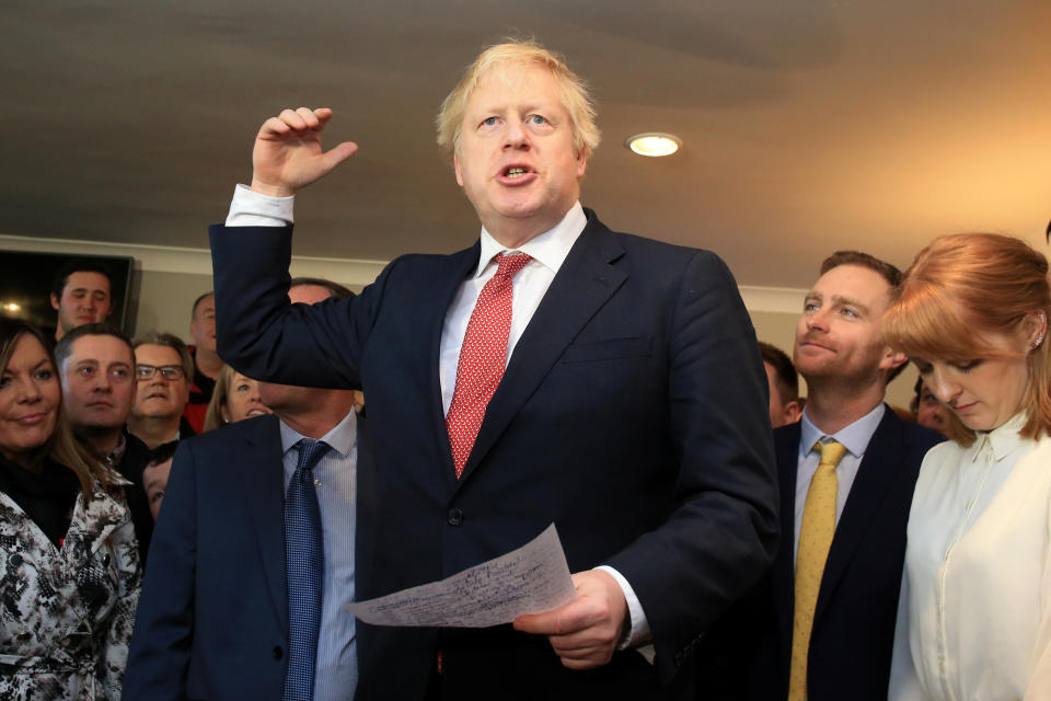 Britain's Prime Minister Boris Johnson gestures as he speaks to supporters on a visit to meet newly elected Conservative party MP for Sedgefield, Paul Howell, at Sedgefield Cricket Club in County Durham, north east England on December 14, 2019, following his Conservative party's general election victory.  Lindsey Parnaby/Pool via REUTERS