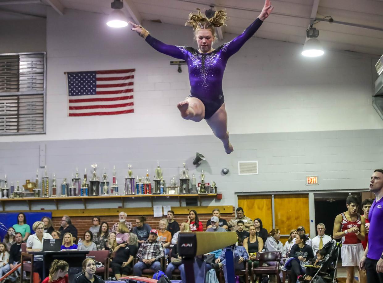 Wylie High School gymnast Ada McCutchen performs a leap with a split on the balance beam at a local competition Jan. 25.