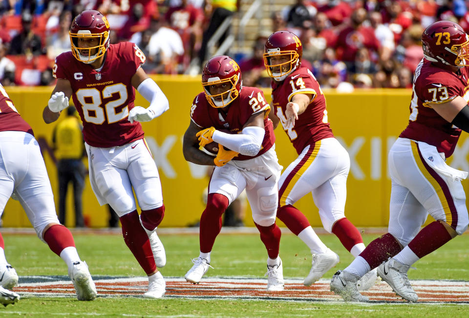 Washington Football Team running back Antonio Gibson carries the ball against the Los Angeles Chargers during the first quarter at FedExField. (Brad Mills/USA TODAY Sports)