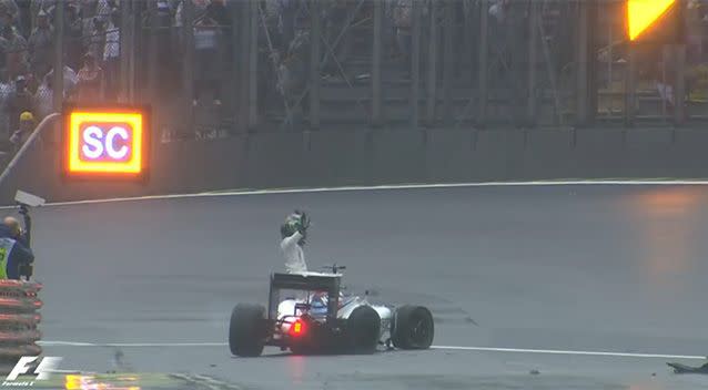 Massa waved to the crowd as he exited his vehicle after crashing out on the 49th lap. Photo: Formula One