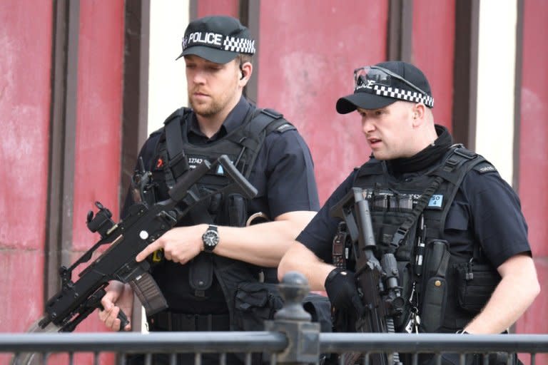 Armed police on patrol near Manchester Arena following a deadly terror attack at an Ariana Grande concert