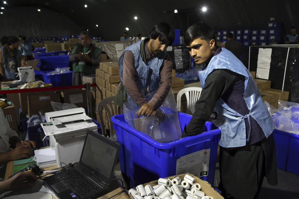 Election commission workers prepare ballot boxes and election materials for the presidential election scheduled for Sept 28, at the Independent Election Commission compound in Kabul, Afghanistan, Sunday, Sept. 15, 2019. Afghan officials say around 100,000 members of the country's security forces are ready for polling day. (AP Photo/Rahmat Gul)