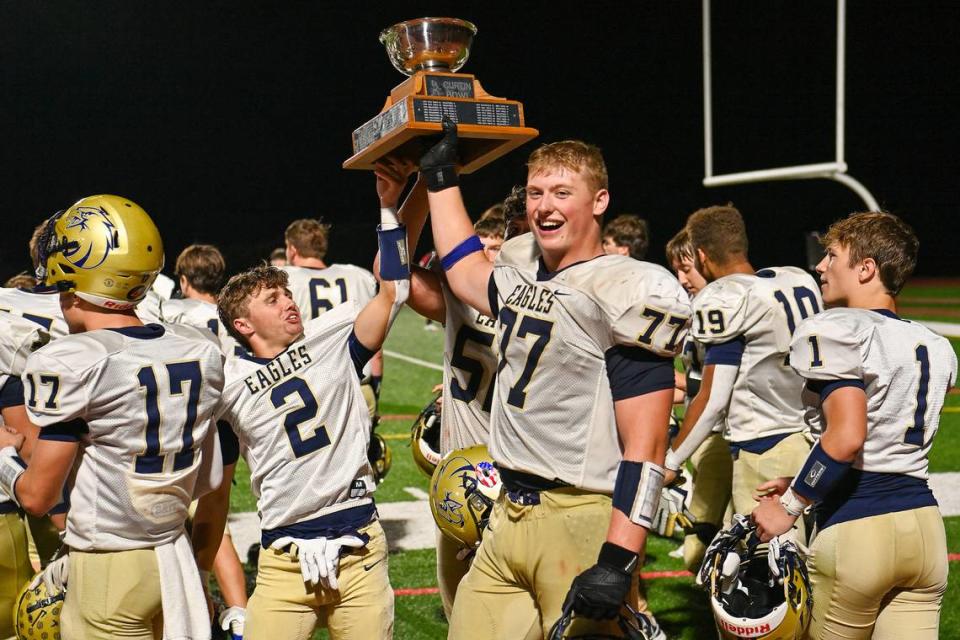 Eric Clark and Kahale Burns celebrate Bald Eagle’s Victory over Bellefonte in this year’s Curtin Bowl game on Friday, Sept. 29, 2023.