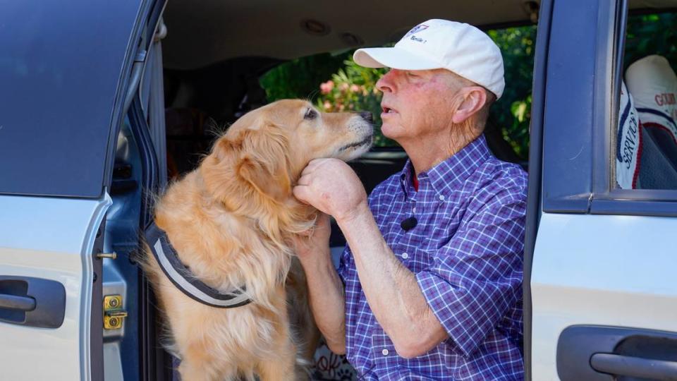 Dan Sievert, founder of Golden Missions of America, plays with his service dog, Cooper. Dan Sievert and his golden retrievers have made 55 missions across the United States over the past decade, helping victims of tragedies work through their trauma. John Lynch/jlynch@thetribunenews.com