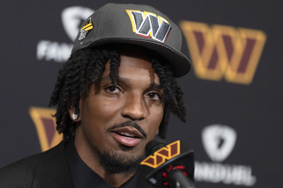 Washington Commanders' first round draft pick Jayden Daniels speaks to reporters during an NFL football news conference in Ashburn, Va., Friday, April 26, 2024. (AP Photo/Manuel Balce Ceneta)