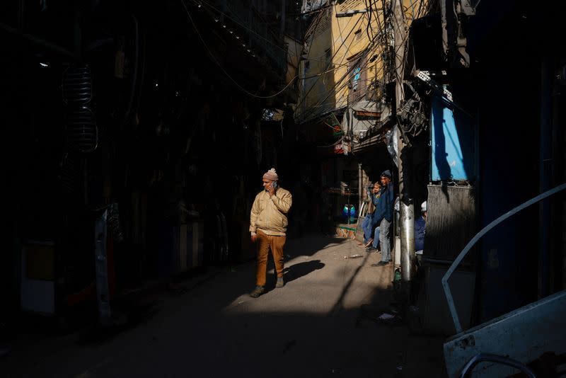 A man walks in the old quarters of Delhi