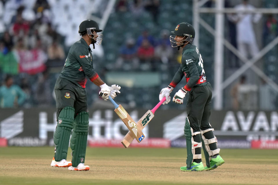 Bangladesh's Shakib Al Hasan, left, celebrates with Afif Hossain after hitting a boundary during the Asia Cup cricket match between Bangladesh and Afghanistan in Lahore, Pakistan, Sunday, Sept. 3, 2023. (AP Photo/K.M. Chaudary)
