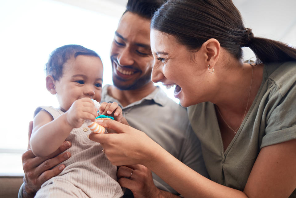 parents laughing with baby