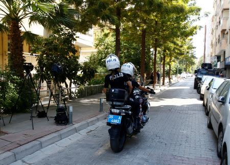 FILE PHOTO: Police officers patrol outside the home of U.S. pastor Andrew Brunson in Izmir, Turkey August 17, 2018. REUTERS/Osman Orsal/File Photo