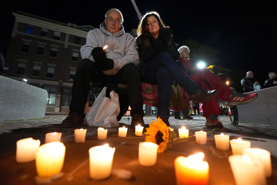 Community members gather Thursday, Nov. 2, 2023, during a candlelight vigil in Auburn, Maine. Locals seek a return to normalcy after a mass shooting in Lewiston on Oct. 25. (AP Photo/Matt York)