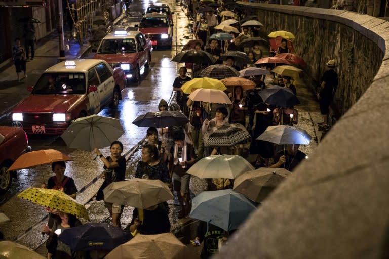 People attend a candlelight march for the late Chinese Nobel laureate Liu Xiaobo in Hong Kong on July 15, 2017