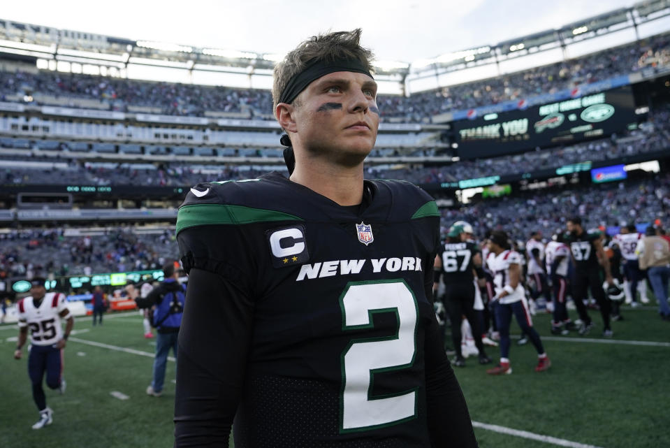 New York Jets quarterback Zach Wilson (2) walks off the field after losing to the New England Patriots 22-17 in an NFL football game, Sunday, Oct. 30, 2022, in New York. (AP Photo/John Minchillo)