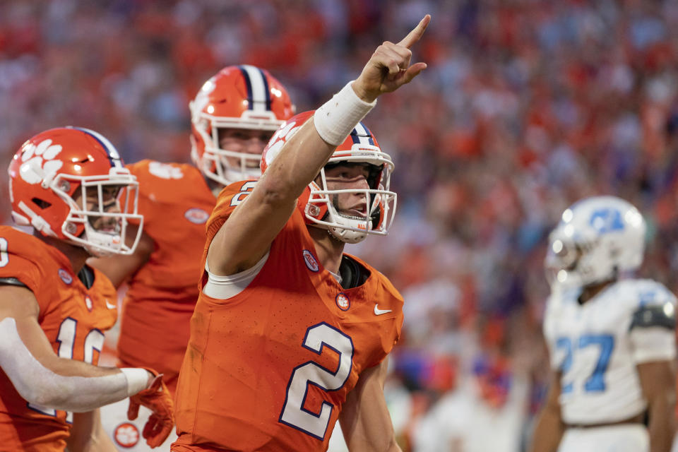 Clemson quarterback Cade Klubnik (2) celebrates after scoring a touchdown during the first half of an NCAA college football game against North Carolina, Saturday, Nov. 18, 2023, in Clemson, S.C. (AP Photo/Jacob Kupferman)