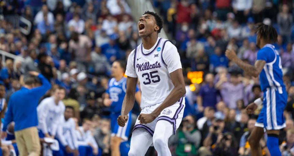 Kansas State’s Nae’Qwan Tomlin reacts after throwing down an alley-oop dunk just before halftime against Kentucky during the first half of their second round NCAA Tournament game in Greensboro, NC on Sunday.