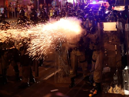 Riot police clash with anti-extradition demonstrators, after a march to call for democratic reforms in Hong Kong