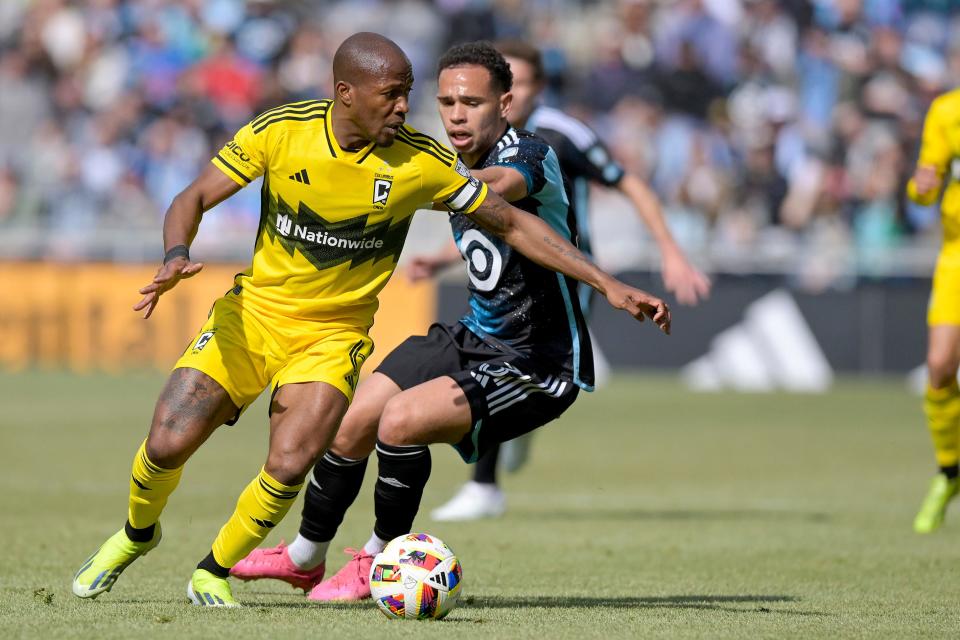 Crew midfielder Darlington Nagbe controls the ball past Minnesot's Hassani Dotson on Saturday.