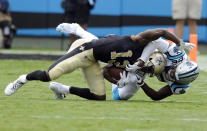 <p>New Orleans Saints’ Michael Thomas (13) is tackled after a catch by Carolina Panthers’ Daryl Worley (26) in the first half of an NFL football game in Charlotte, N.C., Sunday, Sept. 24, 2017. (AP Photo/Mike McCarn) </p>