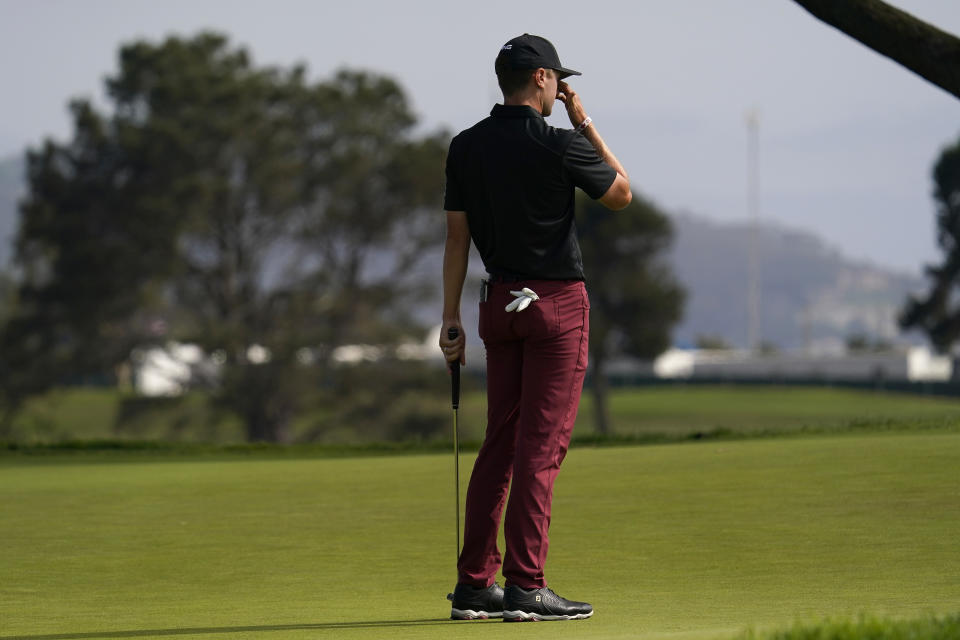 Mackenzie Hughes, of Canada, reacts after missing his putt on the 16th green during the third round of the U.S. Open Golf Championship, Saturday, June 19, 2021, at Torrey Pines Golf Course in San Diego. (AP Photo/Gregory Bull)